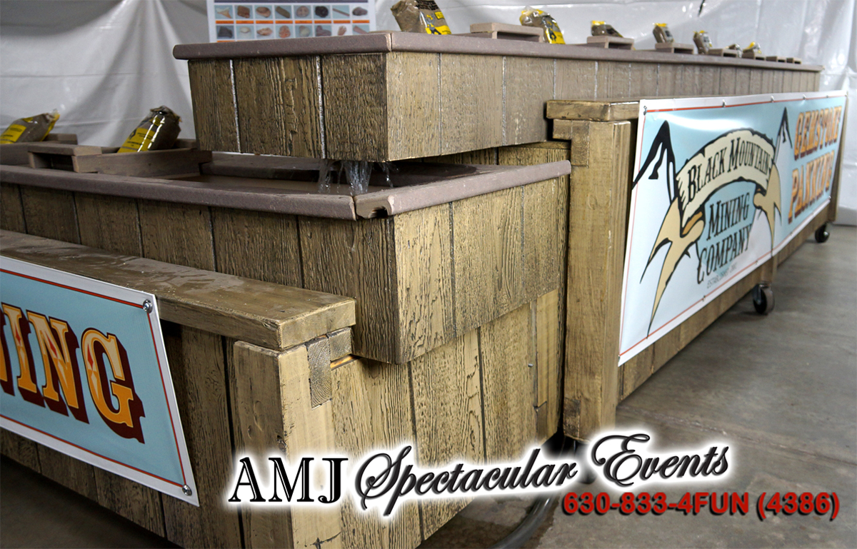 Portable gem stone mining sluice rental where guests sift soil to uncover real mineral gems
