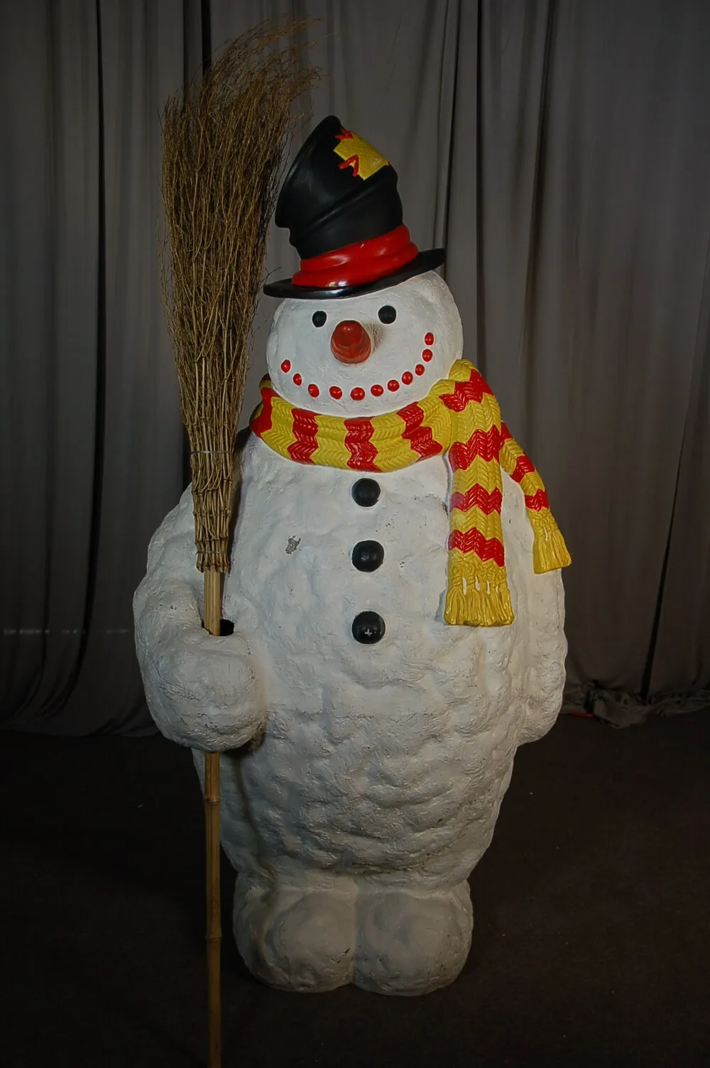Frosty the Snowman statue holding a broom, a festive holiday decor rental from AMJ Spectacular Events