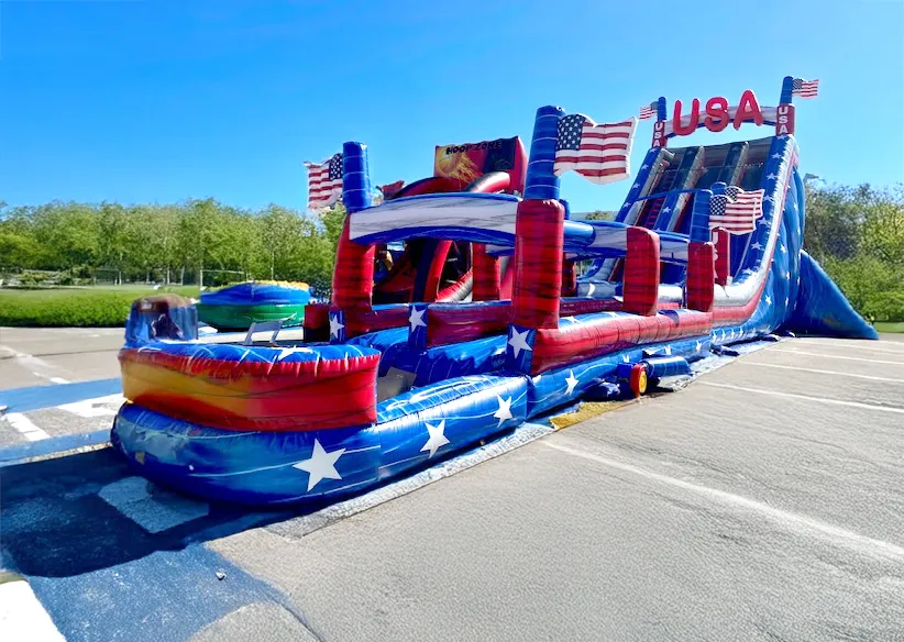 USA 27' Double Giant wet slide rental in patriotic red, white, and blue with dual racing lanes
