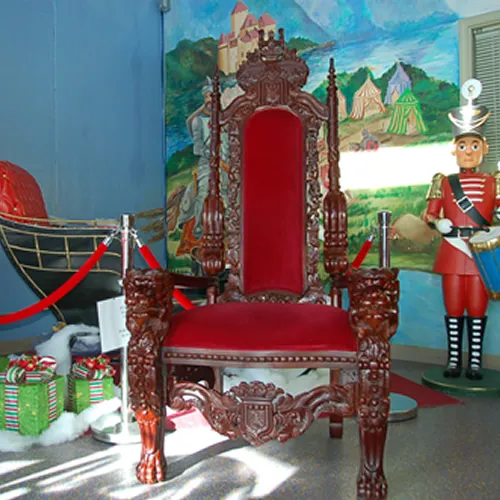 Santa's Premium Red Velvet Throne, a hand-carved royal red velvet chair for holiday parties and Santa photos