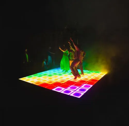 Multi-color opaque LED dance floor glowing at a Chicagoland event, available for rental from AMJ Spectacular Events