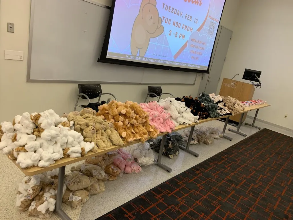 Stuff A Plush 8" animal activity with plush critters, stuffing, hearts, and birth certificates at a Chicago event