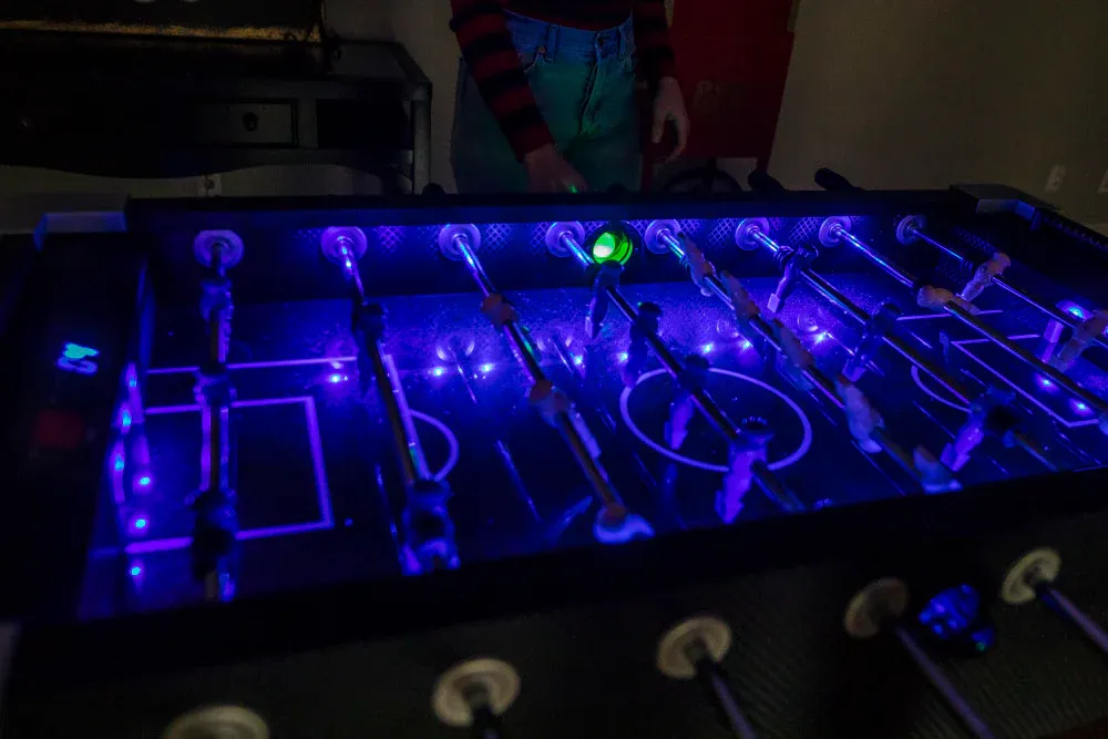 4 player LED foosball table rental glowing with bright lights for Chicago glow parties and arcade events