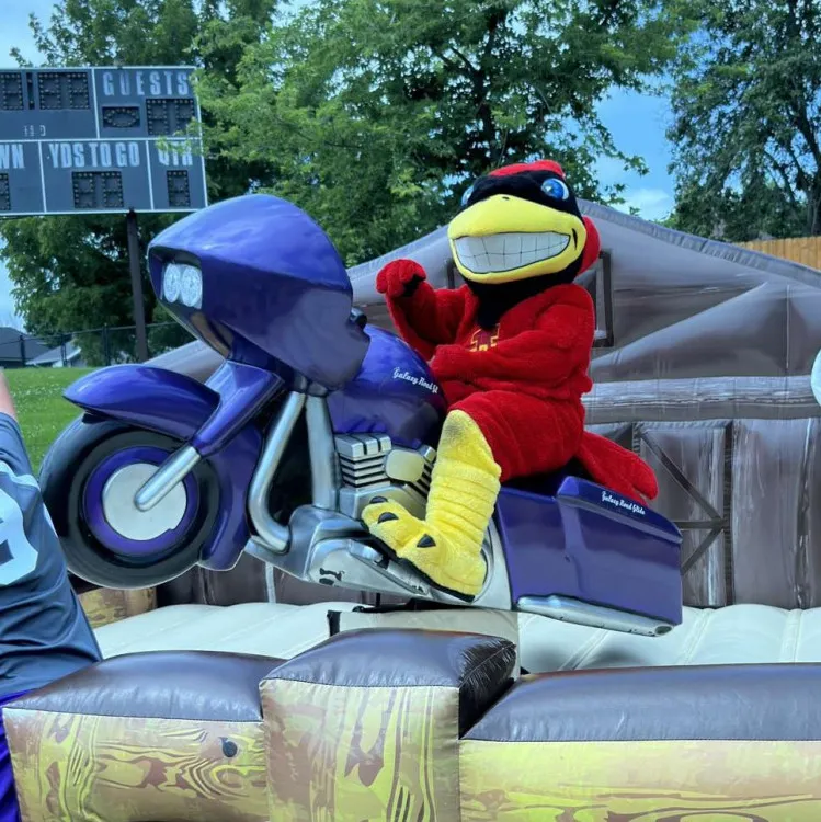 Purple Mechanical Motorcycle Ride rental that spins and bucks for exciting all-ages event fun