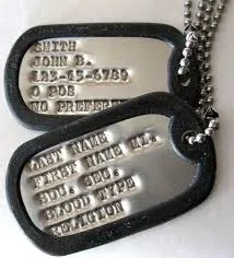 Military dog tag embossing station rental making personalized keepsake tags at a Chicago event