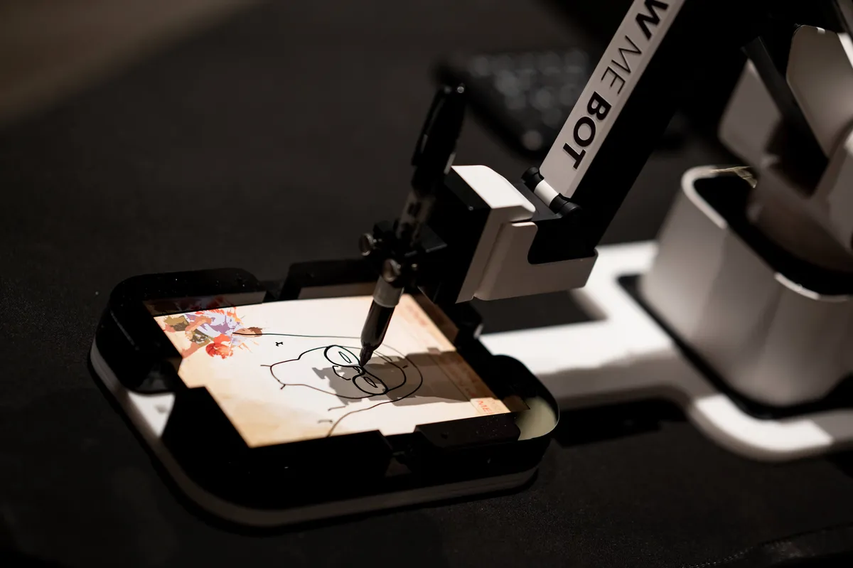 Draw Me Bots Experience robotic arm sketching a guest's photo into a keepsake portrait at a Chicago event