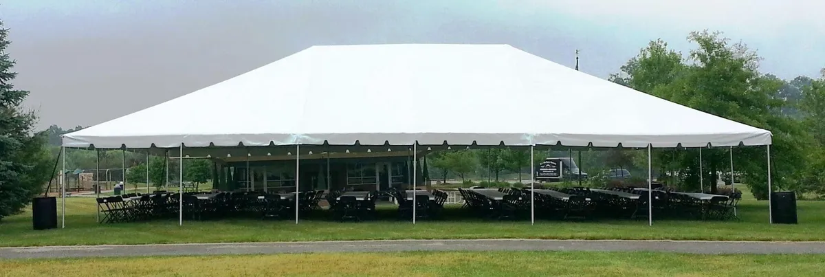 White 40'x40'x15' frame tent rental with open interior and no center poles for Chicago events