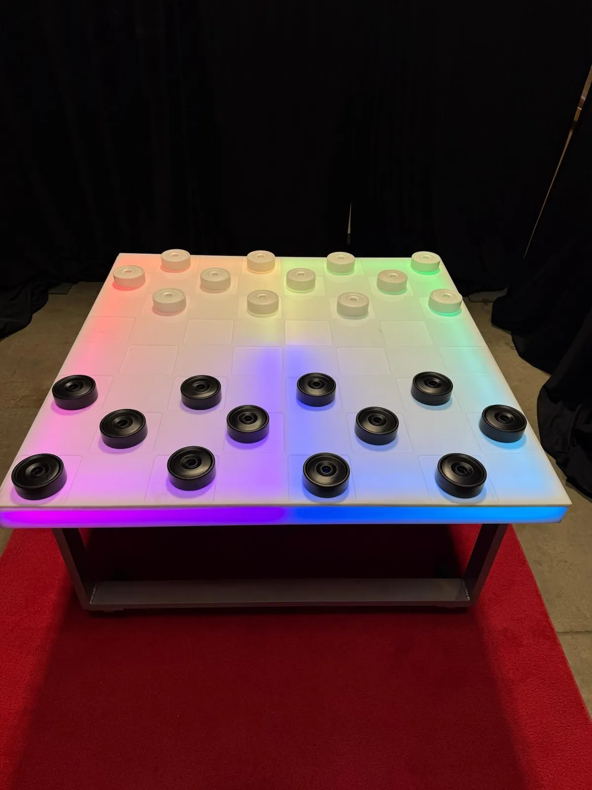 Glowing LED acrylic checkers game with illuminated board and pieces for Chicago events