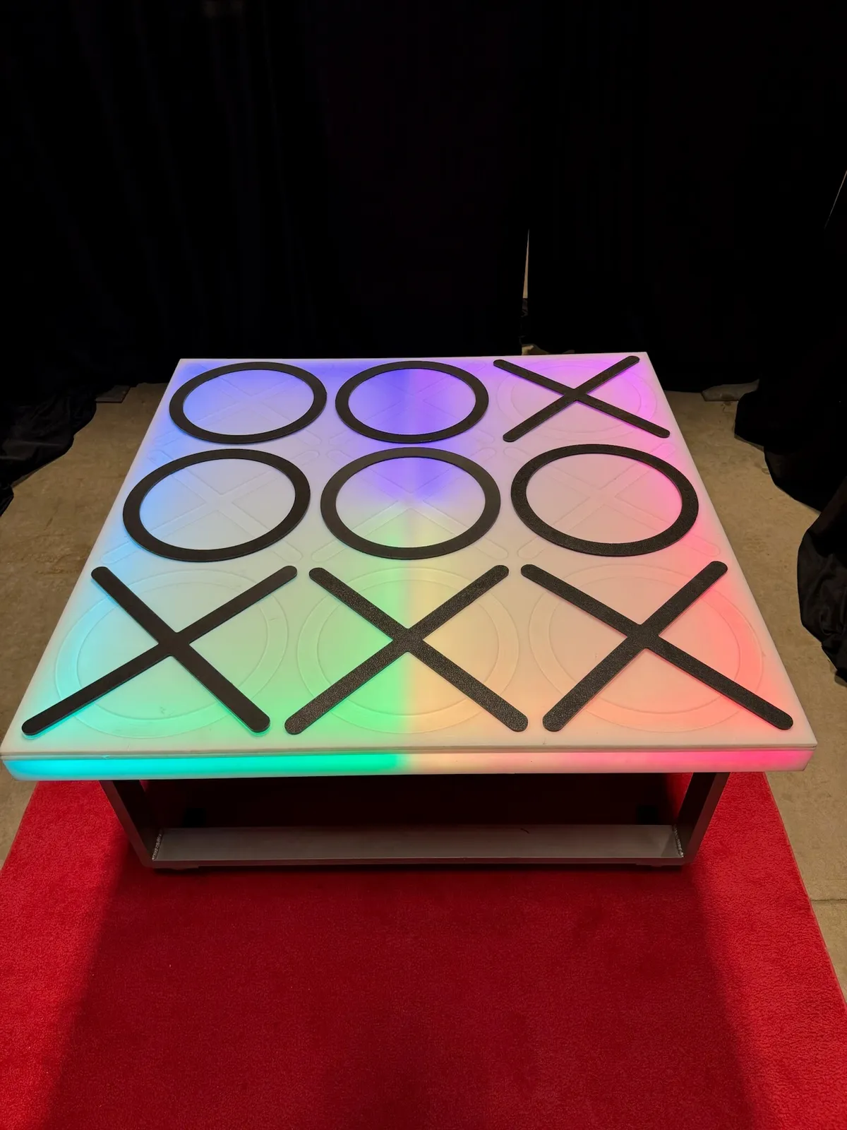 Glowing 4'x4' LED acrylic Tic Tac Toe game rental lit up for a Chicago event