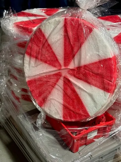 Set of three 18-inch red and white candy cane pinwheels for holiday event decor rental in Chicago