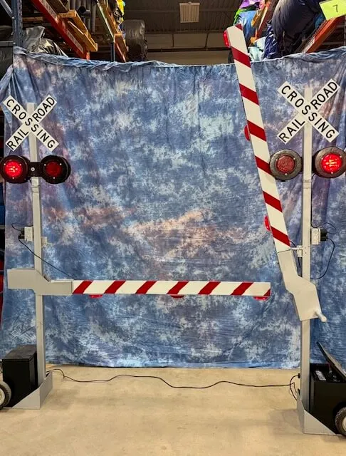 Railroad Gates Deluxe with flashing lights, a trackless train accessory available for rent in Chicago from AMJ.