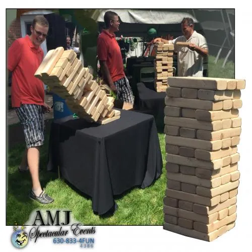Giant Tumble Tower stacking block game for rent at Chicago picnics, reunions, and parties