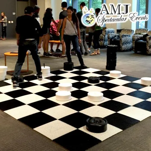 Giant Checkers rental with a 15'x15' walk-on board and over-sized pieces for Chicagoland events