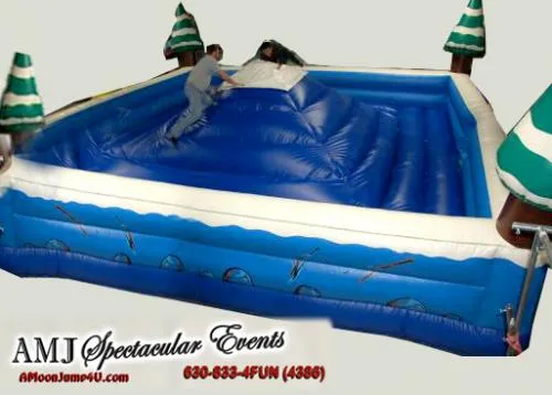 King of the Mountain winter-themed inflatable with snow-capped mountain and evergreens for Chicago holiday events