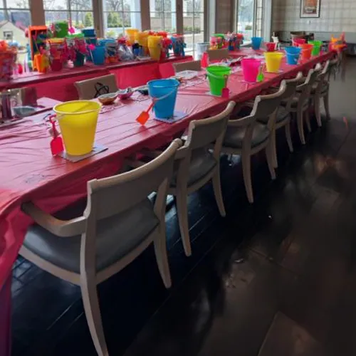 Easter Bucket Craft rental with kids decorating buckets using stickers at a Chicago spring event