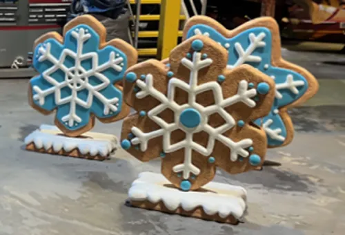 Set of 42-inch gingerbread cookie holiday decorations with intricate designs and vibrant festive colors