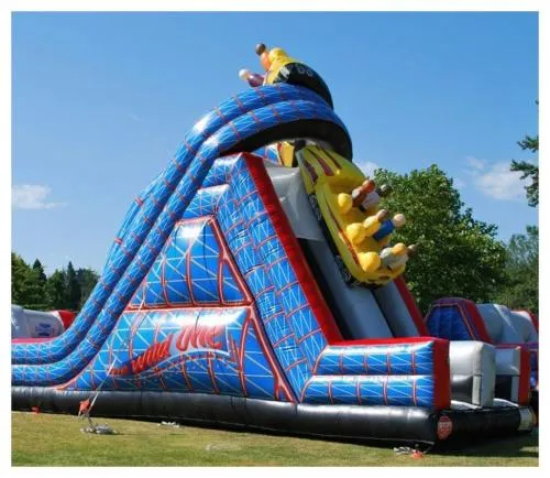 The Wild One double lane inflatable obstacle course with climbing walls, tunnels, and a slide for rent in Chicago