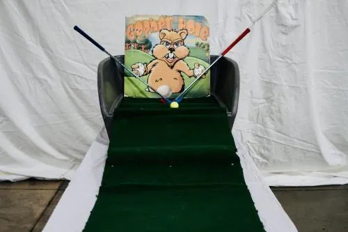Gopher Hole Mini Golf carnival game rental with a par-one putting challenge from AMJ Spectacular Events in Chicago