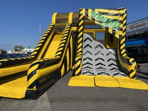 Inflatable Ninja Warrior Warped Wall with three deck-height climbing challenges for events in Chicago