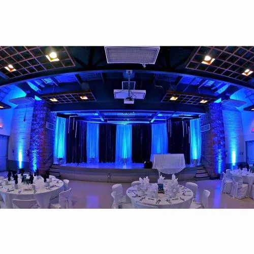 Accent LED uplighting casting colorful glow along an event venue wall for weddings and corporate events in Chicago