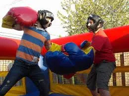 Bouncy Boxing inflatable ring rental with super-sized safe gloves for two players at a Chicago event