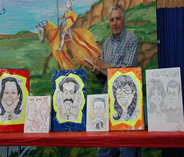 Professional caricature artist sketching fun drawings of guests at a Chicago event