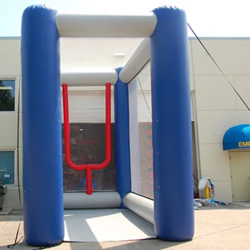Blue and white inflatable Field Goal Football Kick game with red target markers and safety nets on three sides