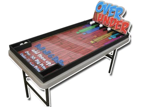 Over and Under carnival table game rental where players roll balls to numbered slots