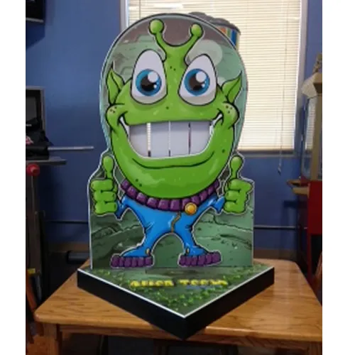 Alien Teeth Knock Out carnival bean bag toss game rental with a cartoon alien target