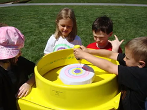 Spin Art Tee machine for creating custom keepsake t-shirts at Chicago parties and events