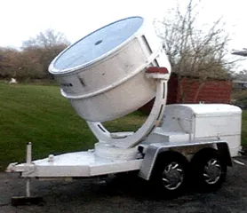 Single beam Hollywood searchlight shining a bright spotlight beam into the night sky for a Chicago event