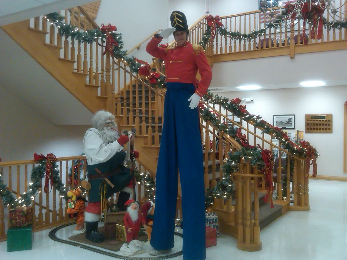 Toy Soldier entertainer on stilts in festive holiday costume for Chicago events