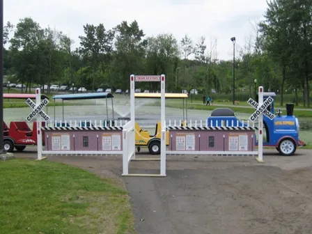 Train Station Depot rental with white picket fencing for organizing a trackless train loading line in Chicago